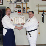 Dojocho Wilkes receiving the Certificate